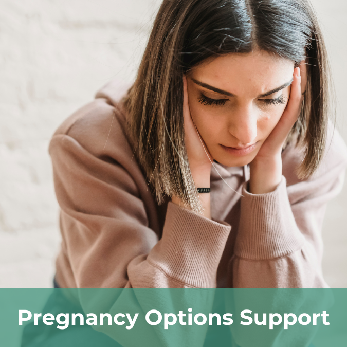 A woman leans forward with her head resting in her hands. She has a concerned expression on her face. There is a text bar on the bottom of the image that reads Pregnancy Options Support.